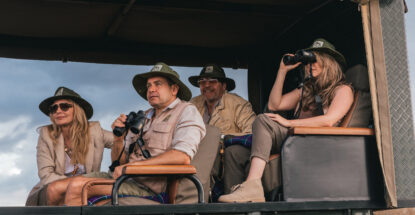 Micato Safaris luxury 4x4 cruiser in wildlife savannah